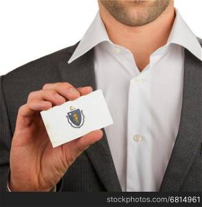 Businessman is holding a business card, flag of Massachusetts