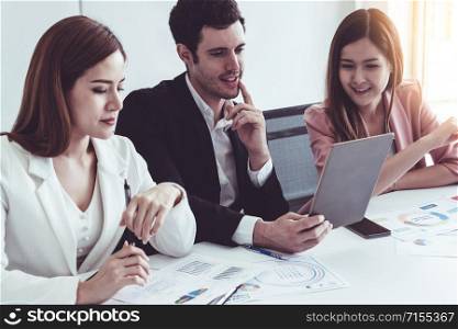 Businessman is in meeting discussion with colleague businesswomen in modern workplace office. People corporate business team concept.