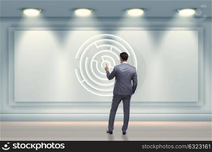 Businessman is looking for ways to escape from maze labyrinth