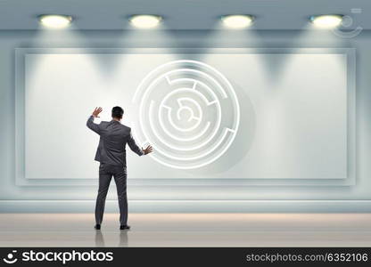 Businessman is looking for ways to escape from maze labyrinth. The businessman is looking for ways to escape from maze labyrinth