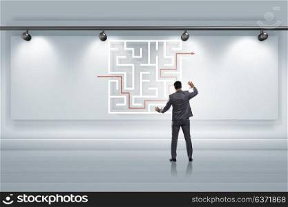 Businessman is looking for ways to escape from maze labyrinth