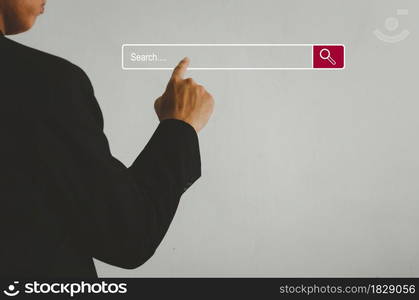 Businessman is touching a search on a virtual screen.Searching information network concept with copy space. internet search page computer touch screen.