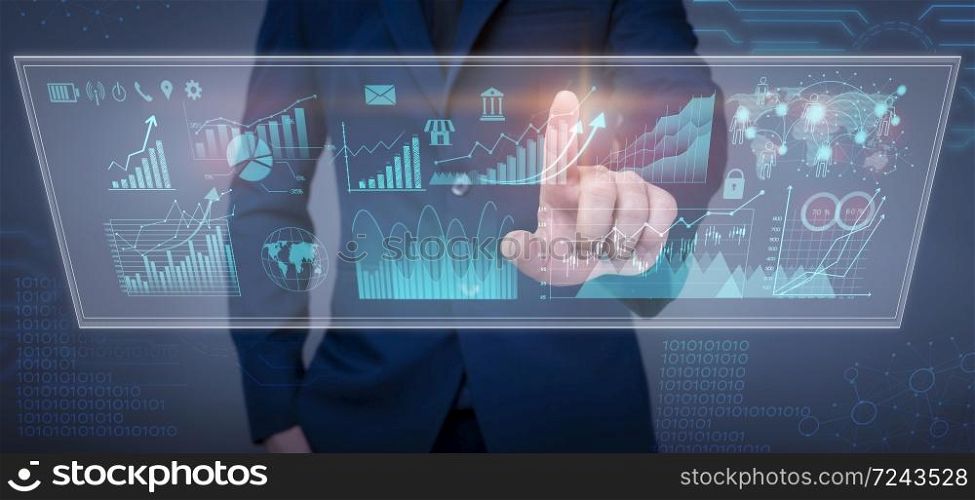 Businessman is touching financial growth graph and analyzing business data on virtual screen, business plan and strategy concept .