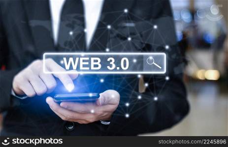 "Businessman is using mobile phone pressing on virtual screen and select "Web 3.0". Concept of modern technology"