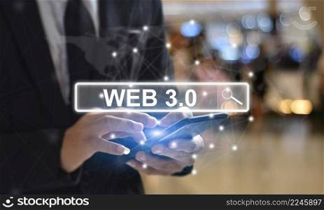 "Businessman is using mobile phone pressing on virtual screen and select "Web 3.0". Concept of modern technology"