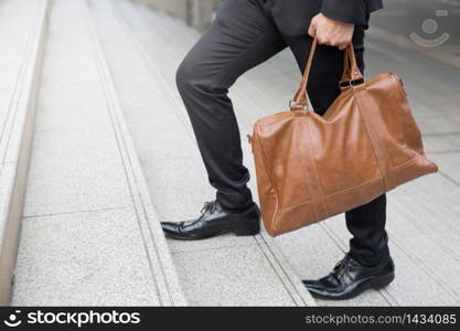 Businessman is walking up the stairs Work at the office