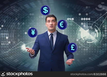 Businessman juggling between various currencies