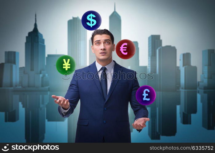 Businessman juggling between various currencies