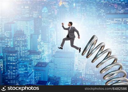 Businessman jumping from spring in promotion concept