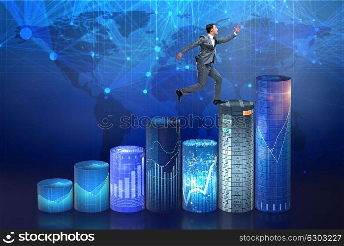 Businessman jumping over bar charts