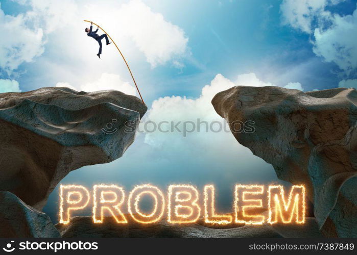 Businessman jumping over burning problems