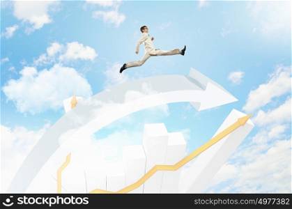 Businessman jumping. Young businessman jumping on white arrows. Growth concept