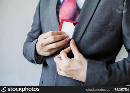 Businessman keeping house as collateral - unpaid real estate and asset seized by man in suit. Businessman keeping house as collateral - unpaid real estate and asset seized by man in suit.
