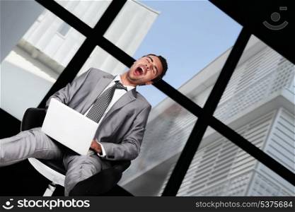 Businessman laughing hysterically