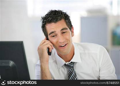 Businessman laughing on the phone