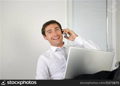 Businessman lauging on the phone