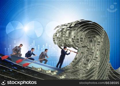 Businessman leading his team through wave of dollars