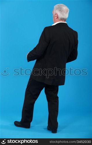 Businessman leaning backwards