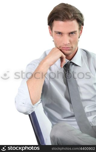 Businessman leaning on his chair