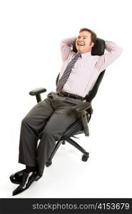 Businessman leans back and relaxes in his comfortable ergonomic chair. Isolated on white.