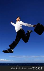 Businessman leaping through the air