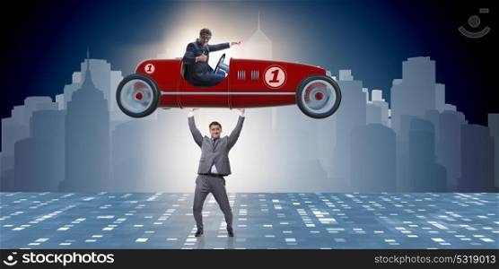 Businessman lifting sports car in power concept