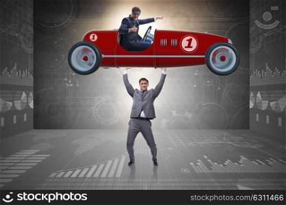 Businessman lifting sports car in power concept