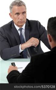 Businessman listening to a colleague