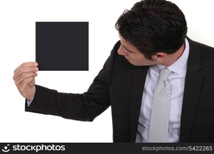 Businessman looking at a blank square