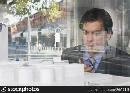 Businessman looking at an architectural model
