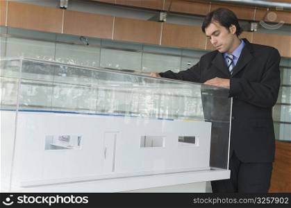 Businessman looking at an architectural model