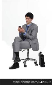 Businessman looking at cellphone