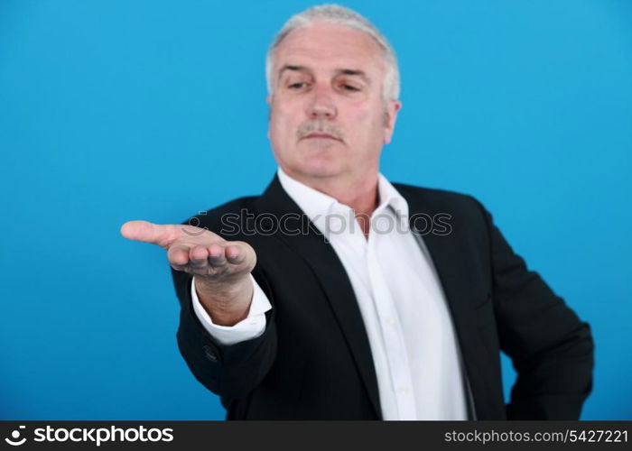 businessman looking at his hand