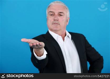 businessman looking at his hand