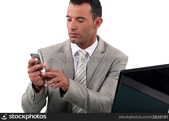Businessman looking at his phone