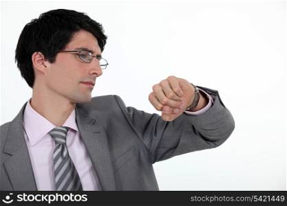 Businessman looking at his watch