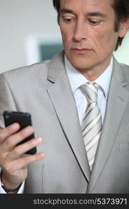 Businessman looking at phone