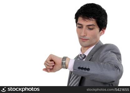 Businessman looking at wrist watch