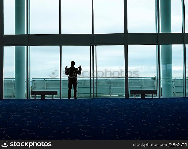 Businessman Looking out Window