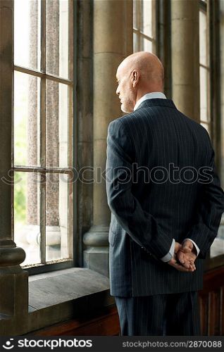 Businessman Looking Out Window