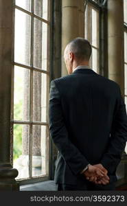 Businessman Looking Out Window