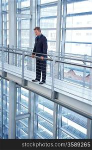 Businessman Looking over Railing