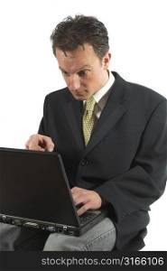 Businessman looking totally shocked at his computerscreen