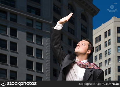 Businessman looking up at sunlight