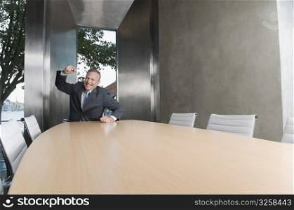 Businessman looking upset in a board room