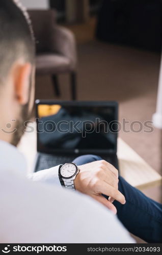 businessman looking wristwatch