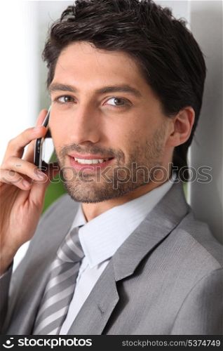 Businessman making call using mobile