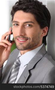 Businessman making call using mobile