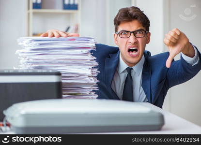 Businessman making copies in copying machine