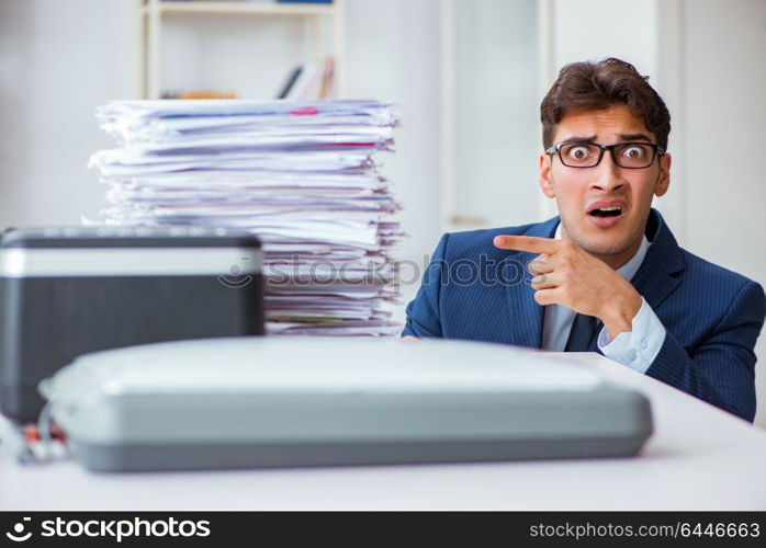 Businessman making copies in copying machine